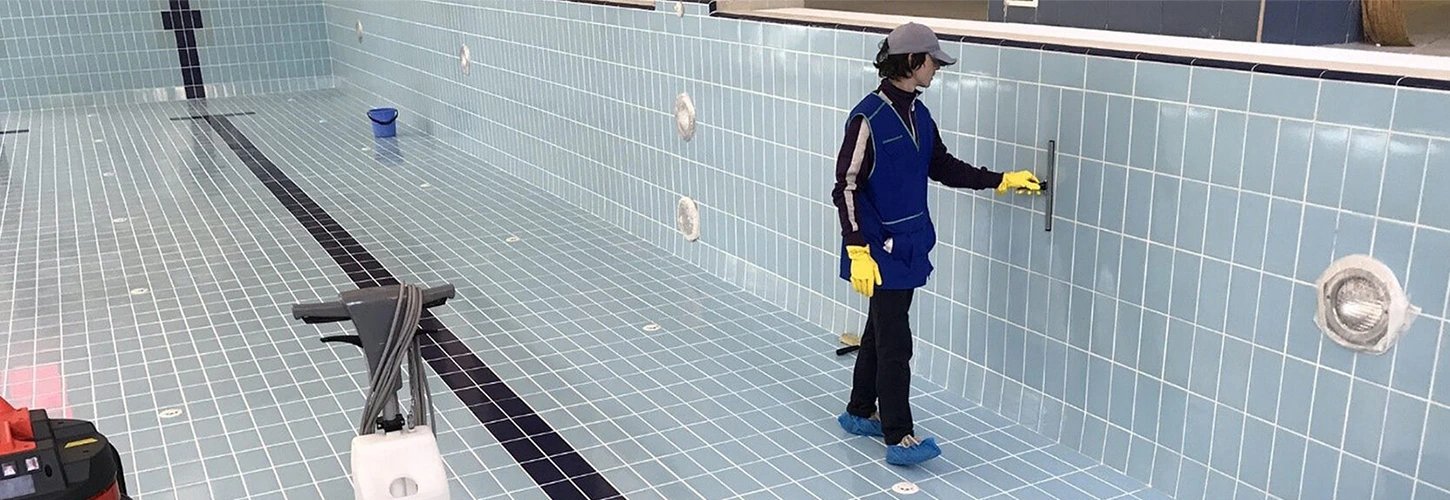 Pool filter cleaning and sanitation service showing cartridge inspection and debris removal